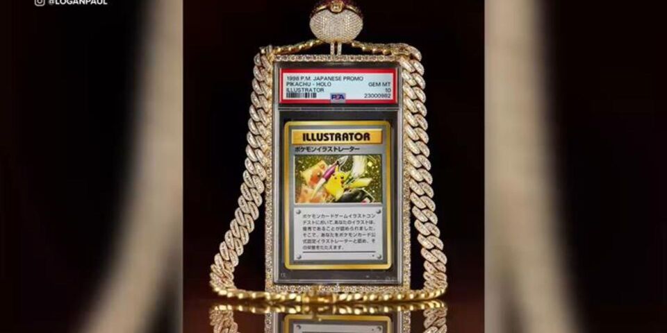 Why Billionaires and Wealthy Collectors Are Moving Into Pokémon Cards PSA 10 Pikachu Illustrator Japanese Pokémon promo card displayed in a diamond-encrusted case with a matching gold and diamond chain.